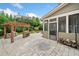 Home exterior featuring an outdoor kitchen under a pergola, with a stone surround at 508 Highland Drive Dr, Woodstock, GA 30188