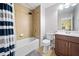 Bathroom with a shower, a bathtub, tile walls, a commode, and a vanity with storage at 508 Highland Drive Dr, Woodstock, GA 30188