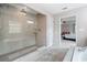 Bright bathroom featuring a glass-enclosed shower and separate soaking tub at 508 Highland Drive Dr, Woodstock, GA 30188