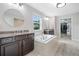 Luxurious bathroom with a soaking tub, dual vanities, and ample storage at 508 Highland Drive Dr, Woodstock, GA 30188