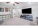 Bright bonus room with neutral carpet, closet, and a large TV at 508 Highland Drive Dr, Woodstock, GA 30188