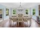 Elegant dining room featuring a large table and chairs and hardwood flooring at 508 Highland Drive Dr, Woodstock, GA 30188