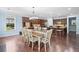 Dining room with a large table and chairs, hardwood floors, and natural light at 508 Highland Drive Dr, Woodstock, GA 30188