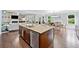 Open kitchen with stainless steel appliances, granite countertops, and hardwood floors at 508 Highland Drive Dr, Woodstock, GA 30188