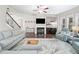 Inviting living room features a fireplace, hardwood floors, and large windows with natural light at 508 Highland Drive Dr, Woodstock, GA 30188