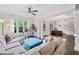 Bright living room featuring hardwood floors, ample seating, and views into the office space at 508 Highland Drive Dr, Woodstock, GA 30188