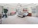 Expansive main bedroom with tray ceiling and a seating area at 508 Highland Drive Dr, Woodstock, GA 30188