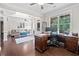 Home office adjacent to the living room featuring natural light and wooden floors at 508 Highland Drive Dr, Woodstock, GA 30188