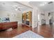 Bright home office with hardwood floors, built-in shelves, and views into the living room at 508 Highland Drive Dr, Woodstock, GA 30188