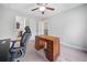 Bright home office with a ceiling fan, neutral walls, and access to the bathroom at 508 Highland Drive Dr, Woodstock, GA 30188