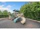 Community playground featuring slides, climbing structures, and soft ground cover for safe play at 508 Highland Drive Dr, Woodstock, GA 30188