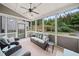 Inviting sunroom featuring comfortable seating and a view of the lush backyard at 508 Highland Drive Dr, Woodstock, GA 30188