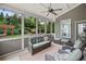 Relaxing sunroom with wicker furniture, neutral rug and open views to backyard at 508 Highland Drive Dr, Woodstock, GA 30188