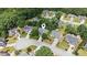 Aerial view of home in a quiet neighborhood, surrounded by lush trees and well-maintained lawns at 726 Sunset Ridge Ln, Lawrenceville, GA 30045