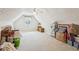 Spacious attic space with ceiling fan and natural lighting at 726 Sunset Ridge Ln, Lawrenceville, GA 30045