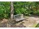 A shaded park bench is nestled in a natural wooded area at 726 Sunset Ridge Ln, Lawrenceville, GA 30045
