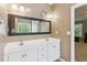 Well-appointed bathroom with double vanity, large mirror, and modern lighting fixtures at 726 Sunset Ridge Ln, Lawrenceville, GA 30045