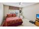 Cozy bedroom featuring a ceiling fan, neutral walls, and a window at 726 Sunset Ridge Ln, Lawrenceville, GA 30045