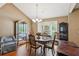 Dining room with a classic table setting, elegant chairs, and natural light, creating a perfect dining space at 726 Sunset Ridge Ln, Lawrenceville, GA 30045