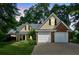 Traditional brick and siding home with a manicured front lawn and two-car garage at 726 Sunset Ridge Ln, Lawrenceville, GA 30045