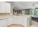 Well-lit kitchen features ample counter space, white appliances, and eat-in breakfast nook at 726 Sunset Ridge Ln, Lawrenceville, GA 30045