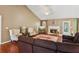 Cozy living room with vaulted ceilings, fireplace, and comfortable seating arrangement at 726 Sunset Ridge Ln, Lawrenceville, GA 30045