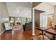 Living area with fireplace, hardwood floors and ample seating, perfect for entertaining or relaxing by the fire at 726 Sunset Ridge Ln, Lawrenceville, GA 30045