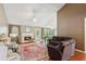 Spacious living room with hardwood floors, a cozy fireplace, and plenty of natural light for a comfortable atmosphere at 726 Sunset Ridge Ln, Lawrenceville, GA 30045