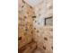 The tiled shower showcases a shower bench, showerhead, and mosaic tiled shower niche at 726 Sunset Ridge Ln, Lawrenceville, GA 30045