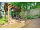 Backyard with a gazebo and lounge chairs, perfect for outdoor relaxation and entertaining at 802 Bluff Pl, Woodstock, GA 30188