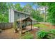 Outdoor view includes a gazebo with seating, a lush garden, and a well-maintained lawn at 802 Bluff Pl, Woodstock, GA 30188