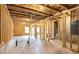 Spacious unfinished basement with exposed framing, concrete floor, and visible utilities; ready to customize at 25 Running Terrace Way, Cartersville, GA 30121