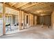 Unfinished basement with exposed wooden framing and concrete flooring, ready for customization at 25 Running Terrace Way, Cartersville, GA 30121
