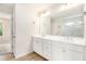 Bright bathroom with double vanity, modern fixtures, and a view of a glass-enclosed shower at 25 Running Terrace Way, Cartersville, GA 30121