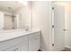 Well-lit bathroom featuring a single vanity and a doorway leading to a shower area at 25 Running Terrace Way, Cartersville, GA 30121