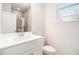 Clean bathroom featuring a single vanity, a framed mirror and a glass-enclosed shower at 25 Running Terrace Way, Cartersville, GA 30121
