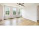 Bedroom space filled with windows, hardwood floors and a light neutral color palette at 25 Running Terrace Way, Cartersville, GA 30121