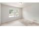 Bright bedroom with carpet, neutral colors, and double windows offering ample natural light at 25 Running Terrace Way, Cartersville, GA 30121