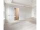 Large bedroom featuring neutral tones, plush carpeting, and a view into an ensuite bathroom at 25 Running Terrace Way, Cartersville, GA 30121