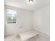 Cozy bedroom with carpet flooring and a window allowing natural light at 25 Running Terrace Way, Cartersville, GA 30121