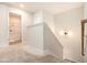 Hallway featuring carpet flooring, and an adjacent laundry room with a washing machine at 25 Running Terrace Way, Cartersville, GA 30121