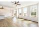 Bright space featuring hardwood floors, a ceiling fan, and sliding doors to the outside at 25 Running Terrace Way, Cartersville, GA 30121