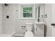 Bathroom features a modern shower, toilet, and sink at 5421 Brownlee Rd, Stone Mountain, GA 30087