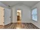 Vaulted bedroom features wood-style floors, view to bathroom, and ample natural light at 2803 Snapfinger Manor Mnr, Decatur, GA 30035