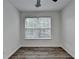 Bedroom featuring a window and wood look laminate flooring at 2803 Snapfinger Manor Mnr, Decatur, GA 30035