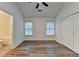 Spacious bedroom features ample natural light and wood-style floors, adjacent to bathroom at 2803 Snapfinger Manor Mnr, Decatur, GA 30035