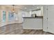 Open dining area features wood-look floors, bay window, and adjacent kitchen at 2803 Snapfinger Manor Mnr, Decatur, GA 30035
