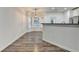 Dining area with wood-look floors, bay window, and modern chandelier at 2803 Snapfinger Manor Mnr, Decatur, GA 30035