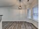 Bright dining room features wood-style flooring, modern light fixture, and natural light at 2803 Snapfinger Manor Mnr, Decatur, GA 30035