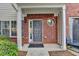 Charming brick townhouse entrance with stylish details, a well-maintained walkway, and tasteful landscaping at 2803 Snapfinger Manor Mnr, Decatur, GA 30035